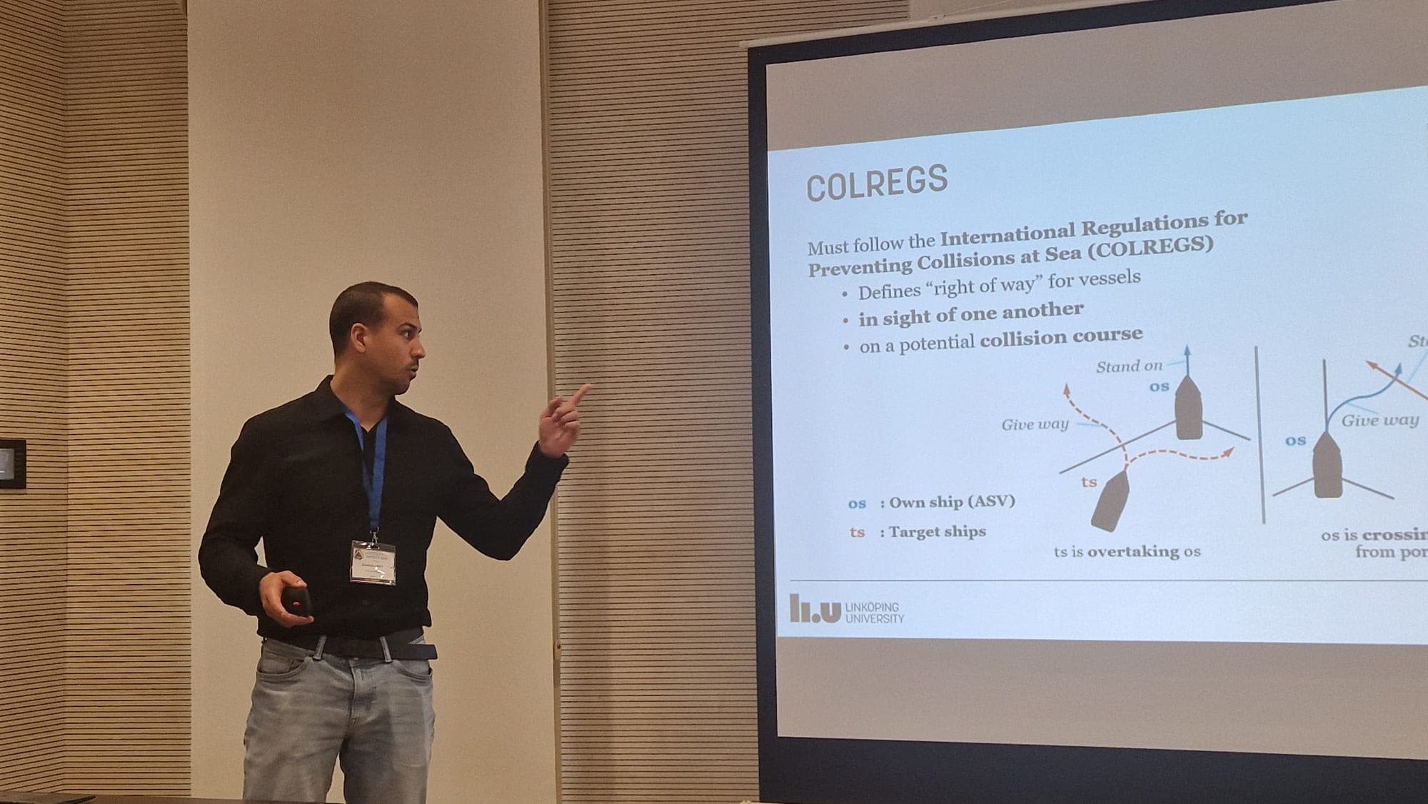 Dominik presenting the COLREGS slide at MODELS 2026